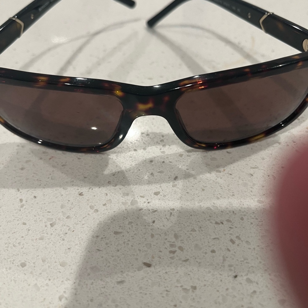 Swarovski Black and gray Ring Elegant Craftsmanship and Burberry sunglasses